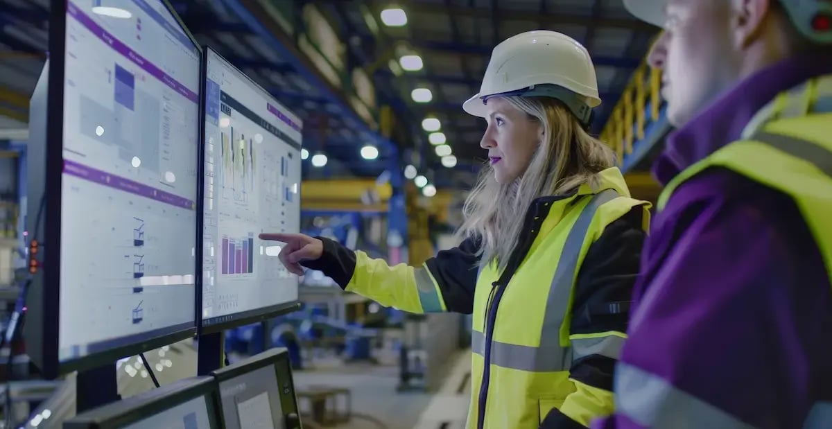 Blog image - Manager looking at Production data