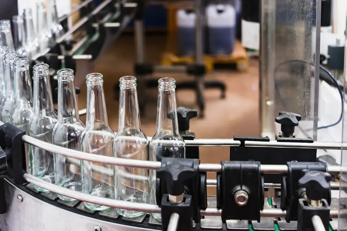 Web / Blog Image - Bottles Travel Down Conveyor